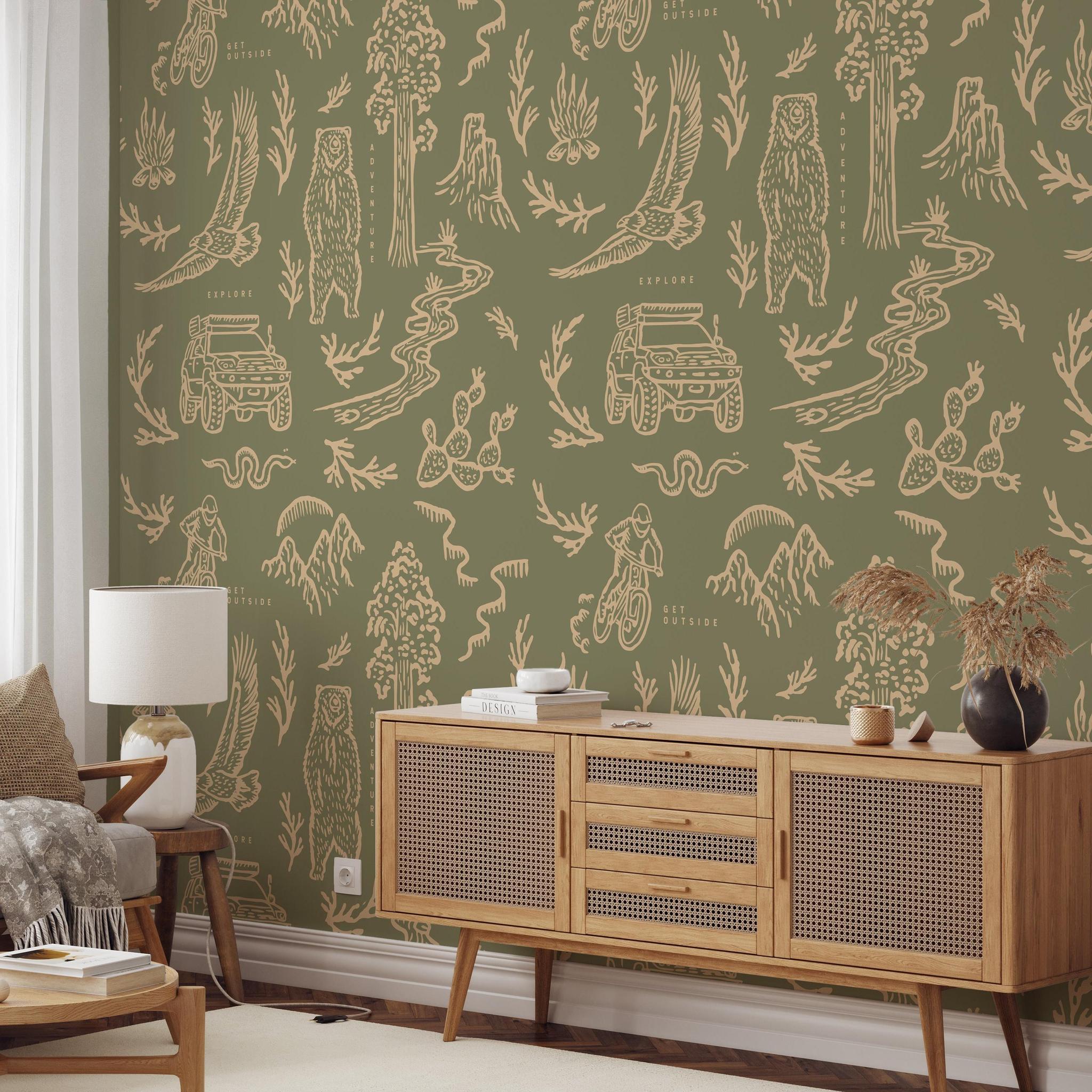 Adventure Awaits (Green) Wallpaper from The Rayco Line displayed in a stylish living room, highlighting wall decor.