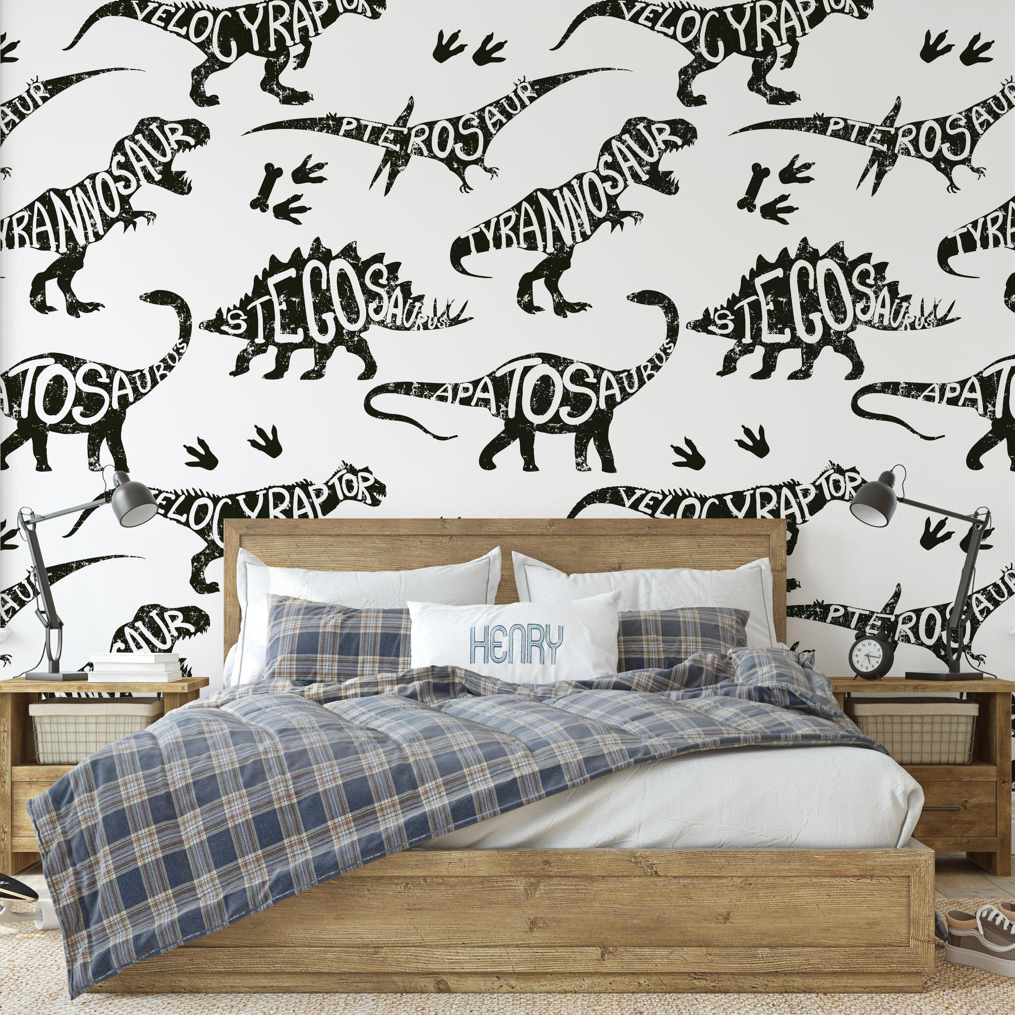 Dino Rush Wallpaper by Wall Blush in a cozy bedroom, highlighting the playful dinosaur pattern focus.