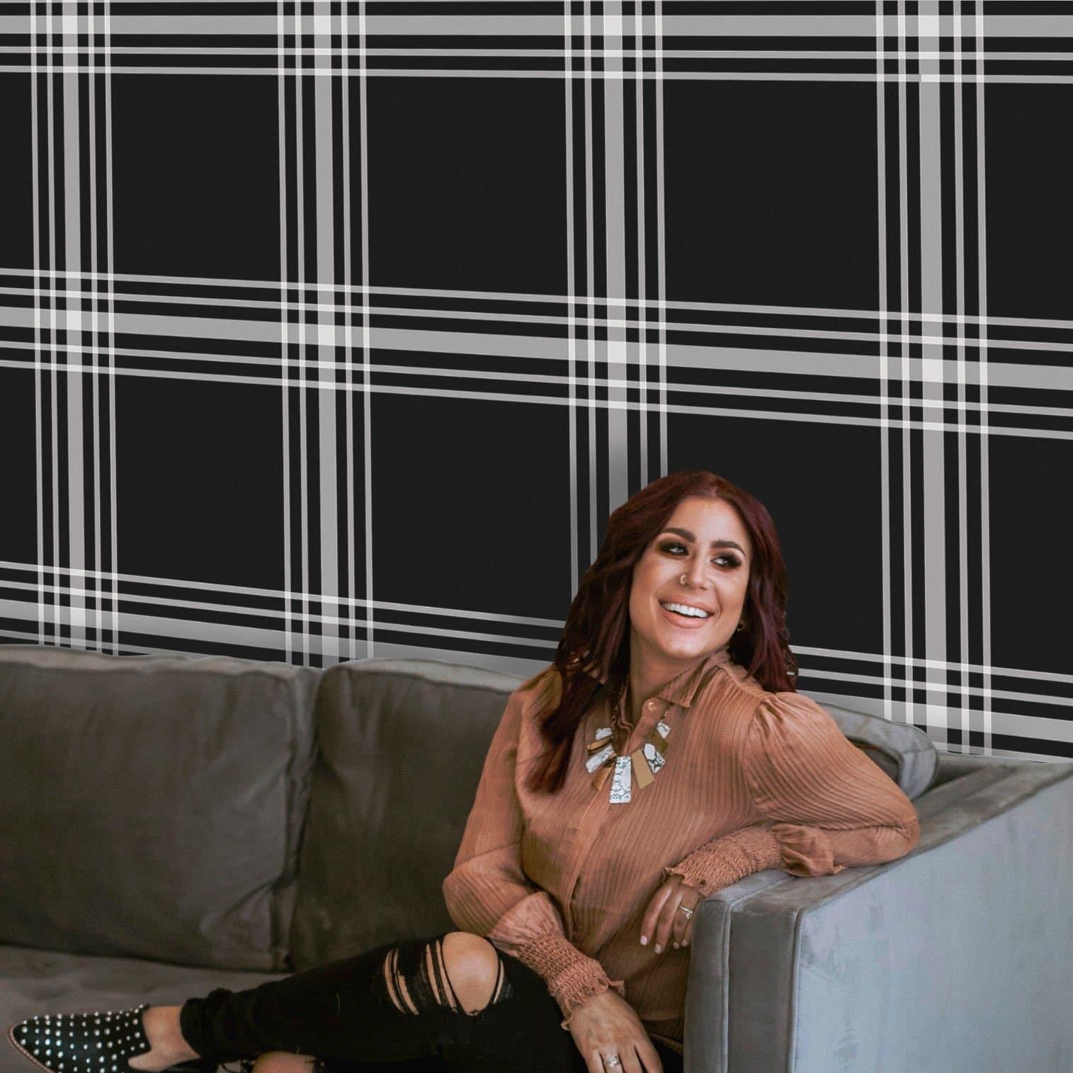 Davenport Wallpaper from The Chelsea DeBoer Line in a modern living room with plaid design focus.