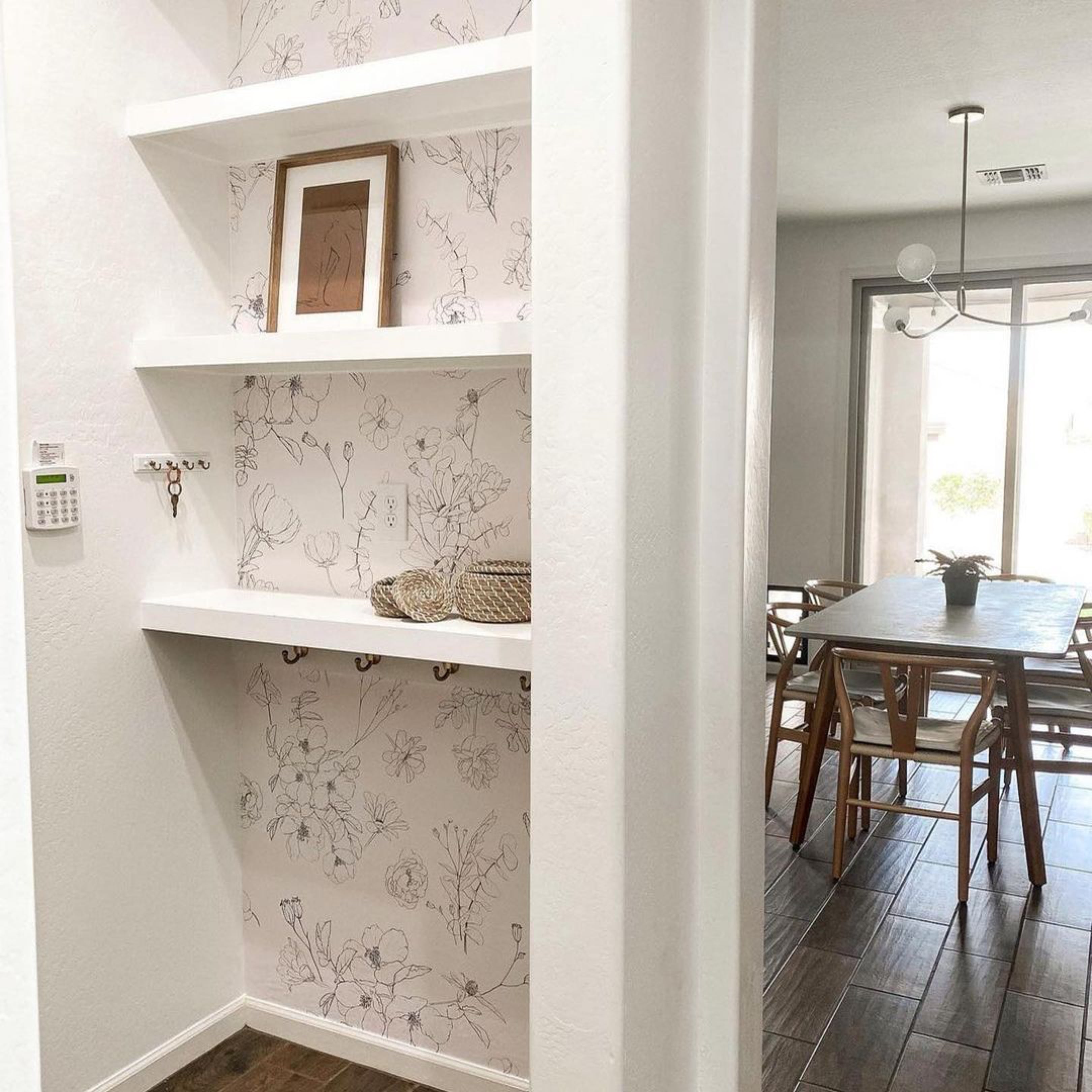 "Lined Meadow Wallpaper by Wall Blush in cozy dining room with elegant botanical design focus"