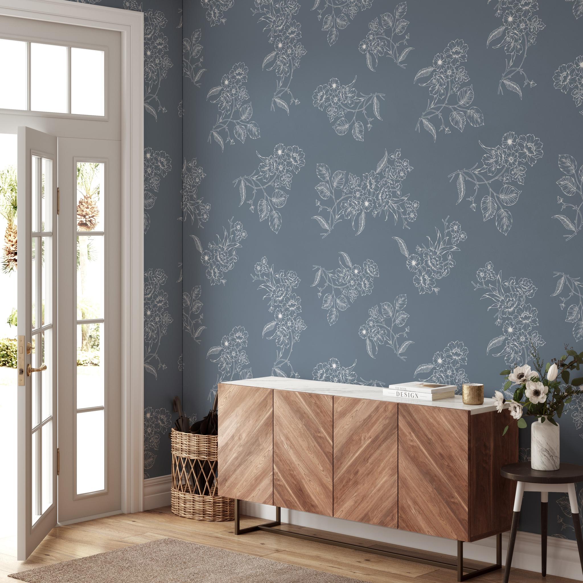"Wall Blush's Tiffanys Wallpaper in an elegant living room setting with focus on the floral design."