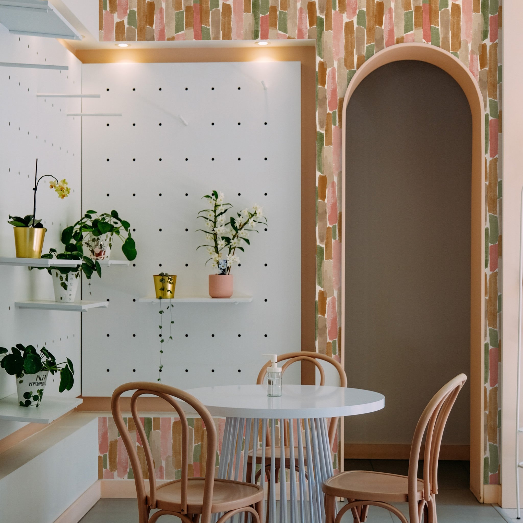 "Hewitt Wallpaper by Wall Blush in a stylish dining room, showcasing the wall decor's pattern and texture."