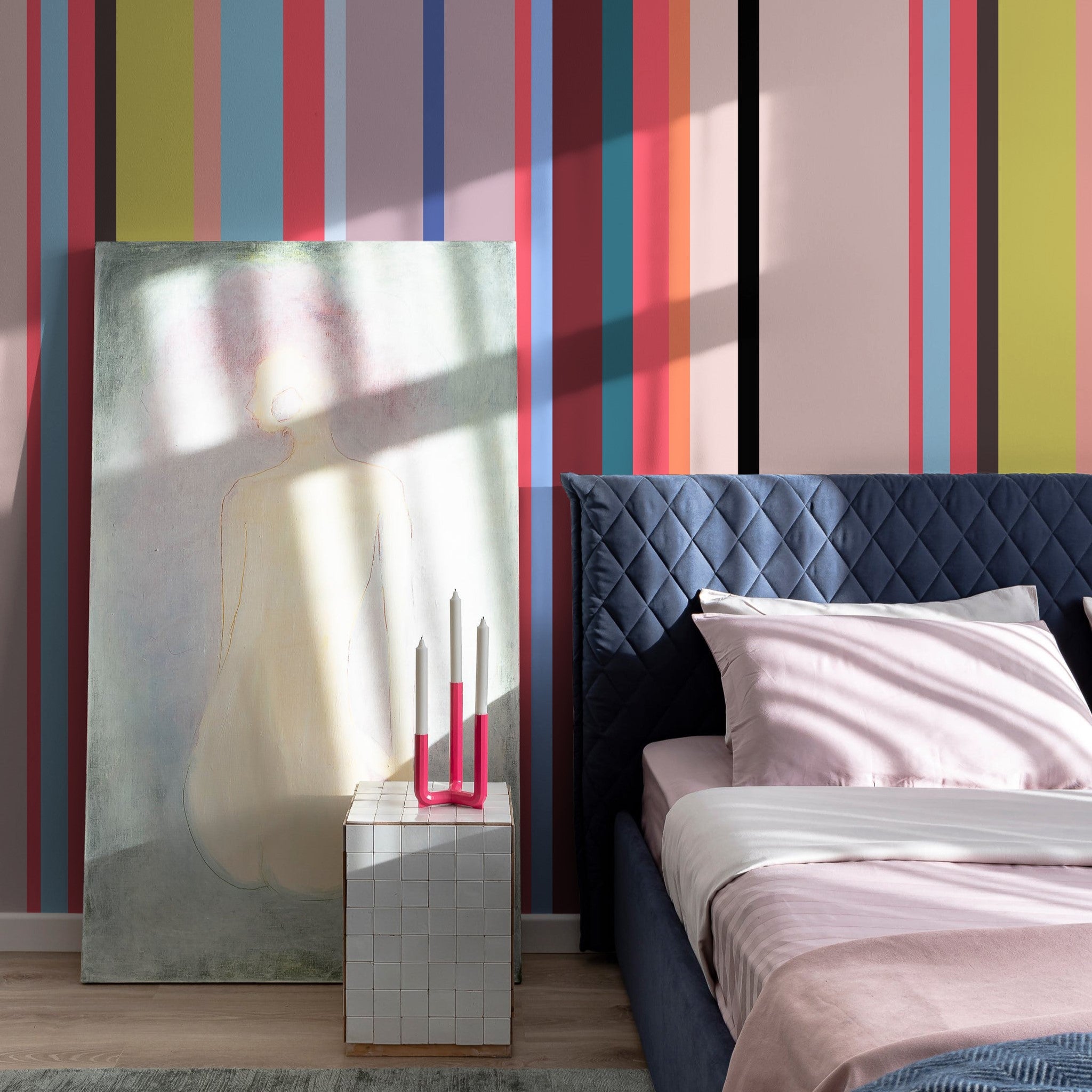 "Wall Blush's So Fetch Wallpaper featured in a modern bedroom, colorful striped design as the focal point."