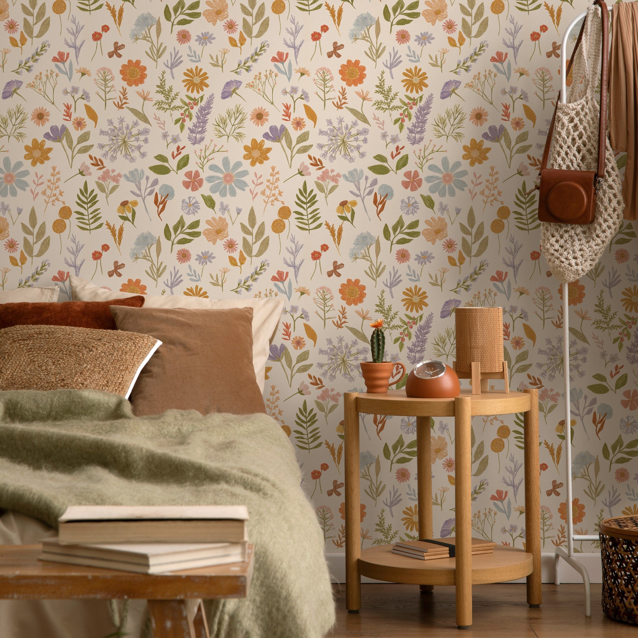 "Lily's Field Wallpaper from Wall Blush enhancing a cozy bedroom interior, with a focus on the vibrant floral design."