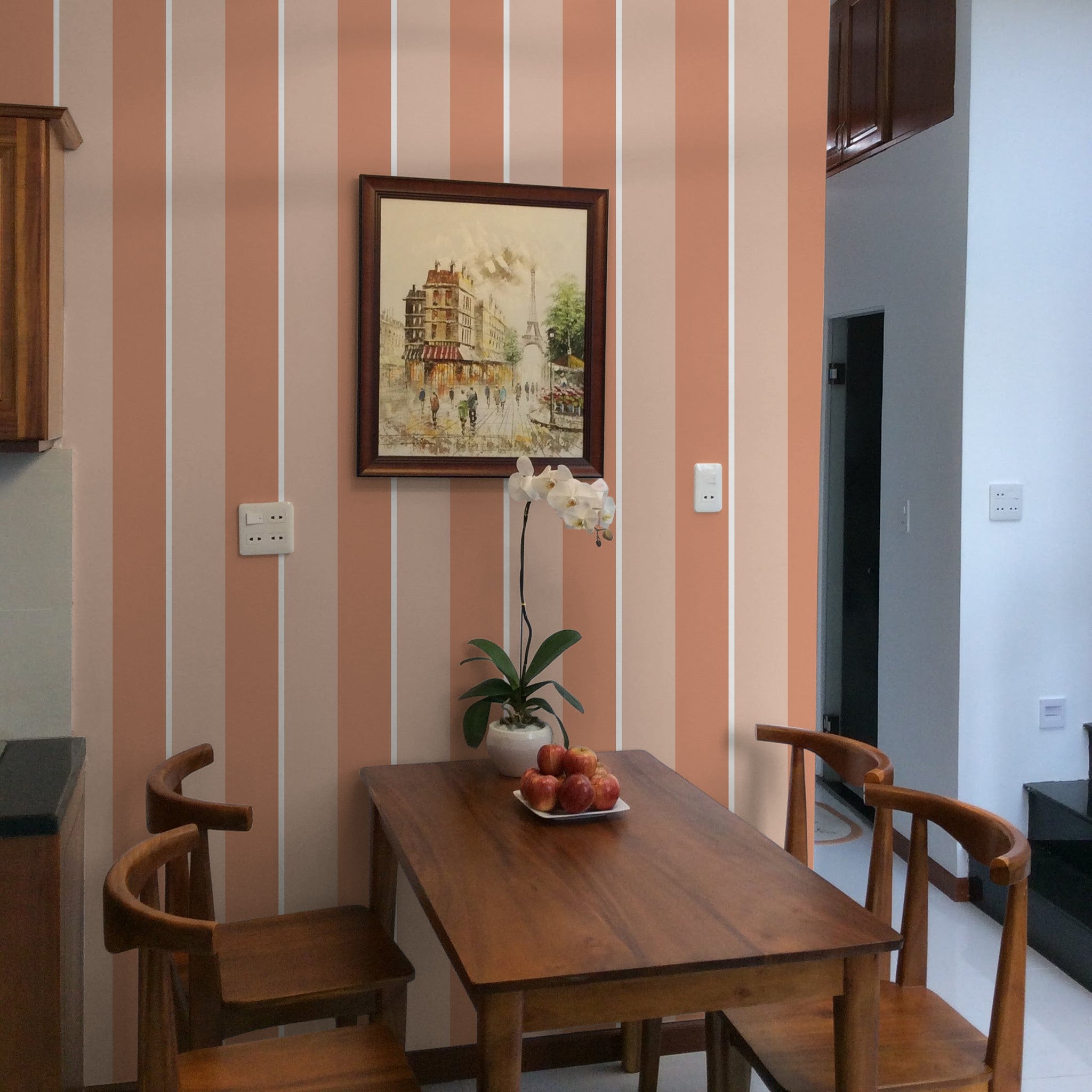 "Wall Blush's Life's A Peach Wallpaper in modern dining room with wooden furniture and decor accents."
