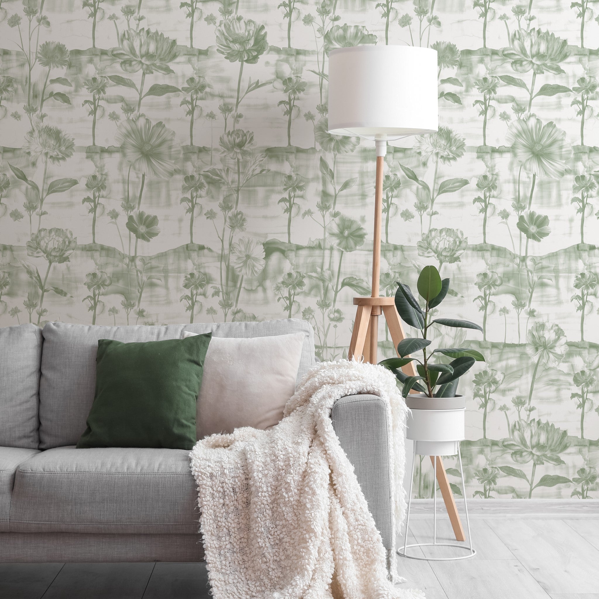 "Lavina (Green) Wallpaper by Wall Blush in a cozy living room setup highlighting elegant floral designs."