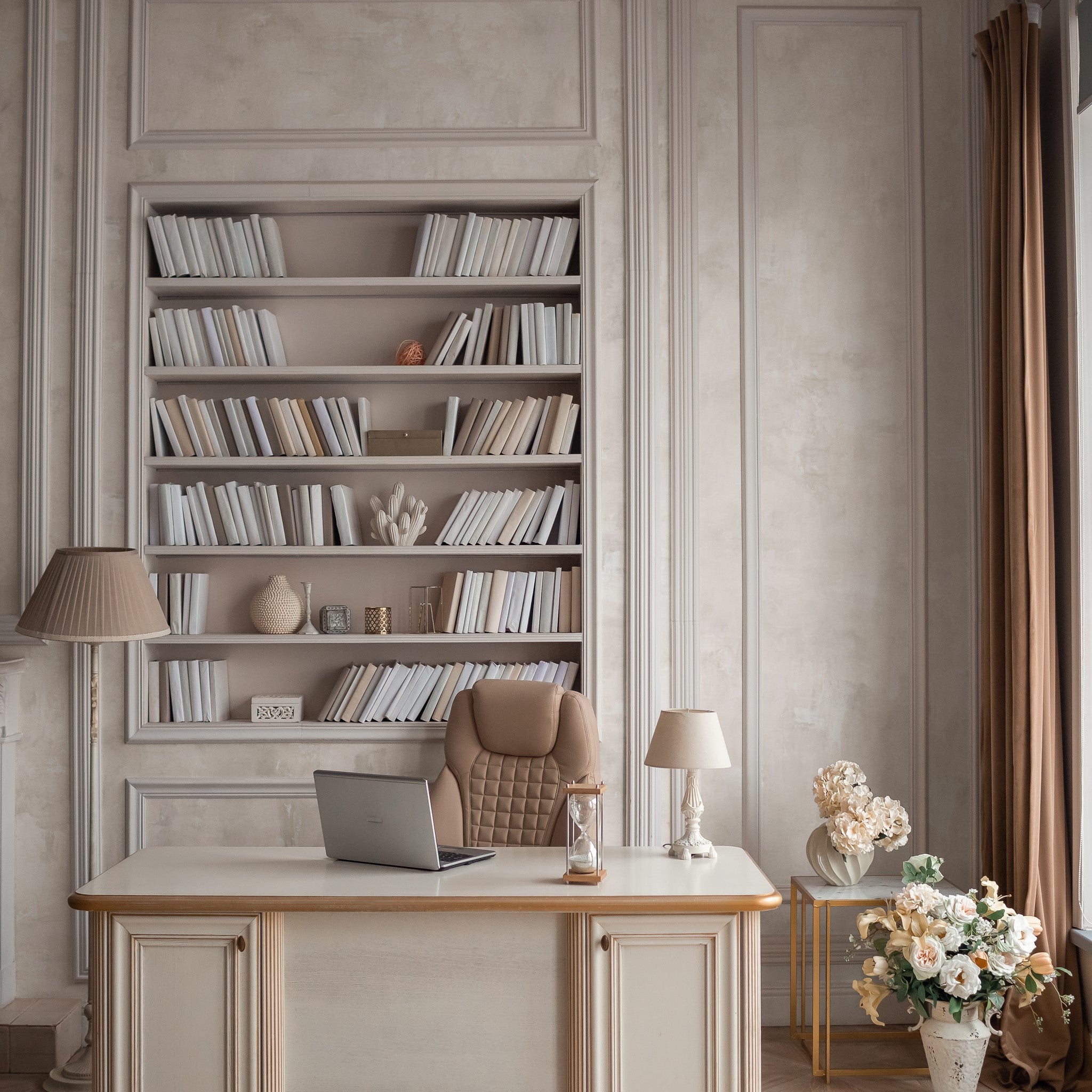 "Luna Wallpaper by Wall Blush enhances a cozy home office with elegant bookshelves and warm decor."