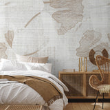 "Cozy bedroom featuring Wall Blush's Gayle Wallpaper with elegant botanical design, highlighting warm aesthetic."