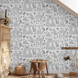 "Wall Blush Woodland Wallpaper featured in a cozy children's room, highlighting playful animal patterns."