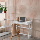 Alt: "Coral Cascades Wallpaper by Wall Blush enhancing a modern home office with focus on the textured wall finish."