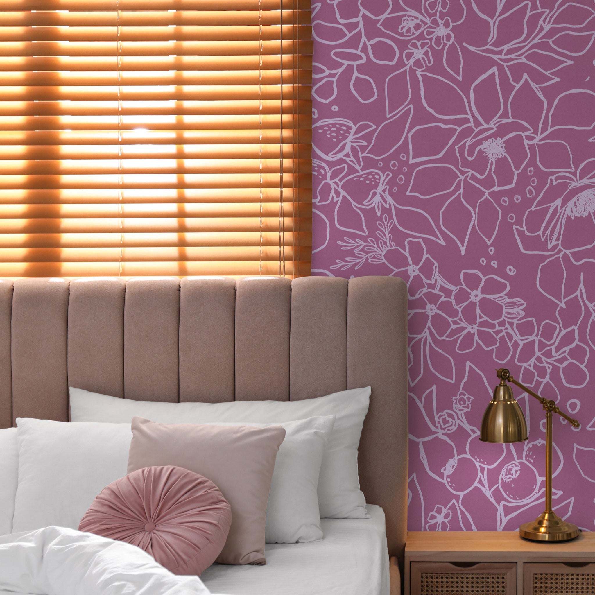 "Wall Blush's Paige (Pink) Wallpaper in a cozy bedroom setup, showcasing the vibrant floral patterns."