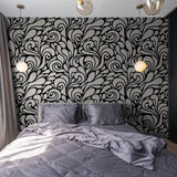 "Wall Blush's Flowers of Jade Wallpaper in a stylish bedroom, elegant black and white design focus."