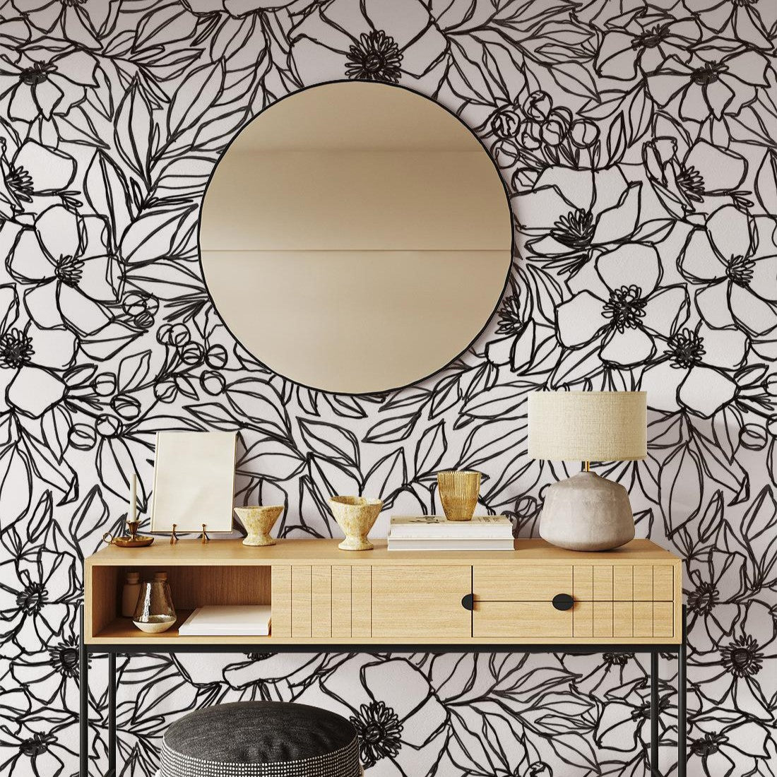 "Elegant Inked Blossom Wallpaper by Wall Blush, showcasing a modern living room interior with decorative accents."