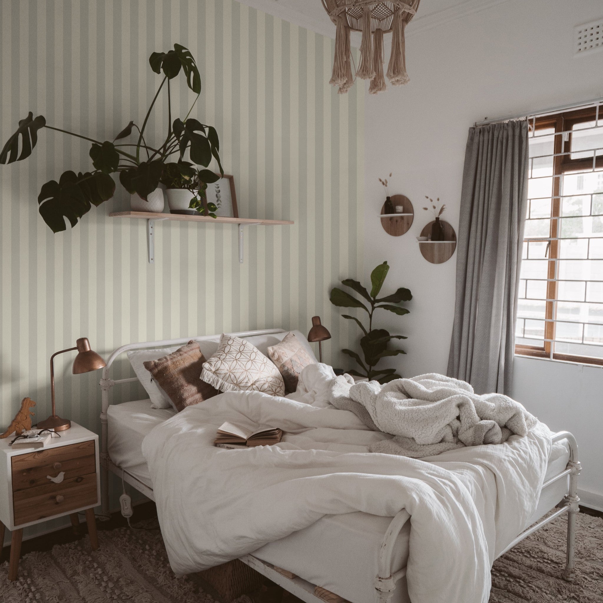 "Cozy bedroom featuring Wall Blush's Marley Wallpaper, with elegant striped design and serene decoration."