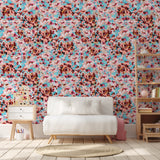 "El Palo Wallpaper by Wall Blush adorning the living room walls, with sofa and shelving decor."