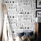 "Wall Blush's Trail Blazer Wallpaper featuring outdoor adventure print in a stylish kids' room decor"
