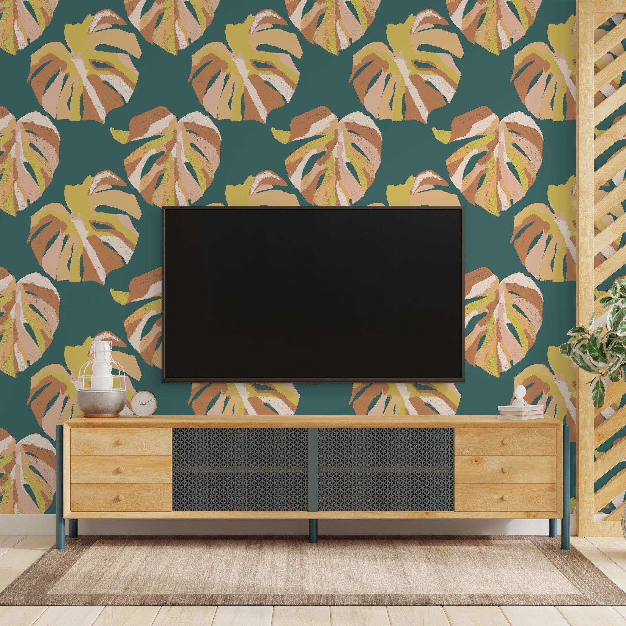 "Wall Blush Monstera Wallpaper in cozy living room, vibrant botanical print, interior design focus."