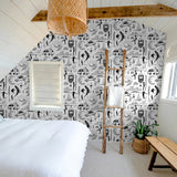 "Saltwater Surf Wallpaper by Wall Blush accentuating the bedroom's decor with its playful design."
