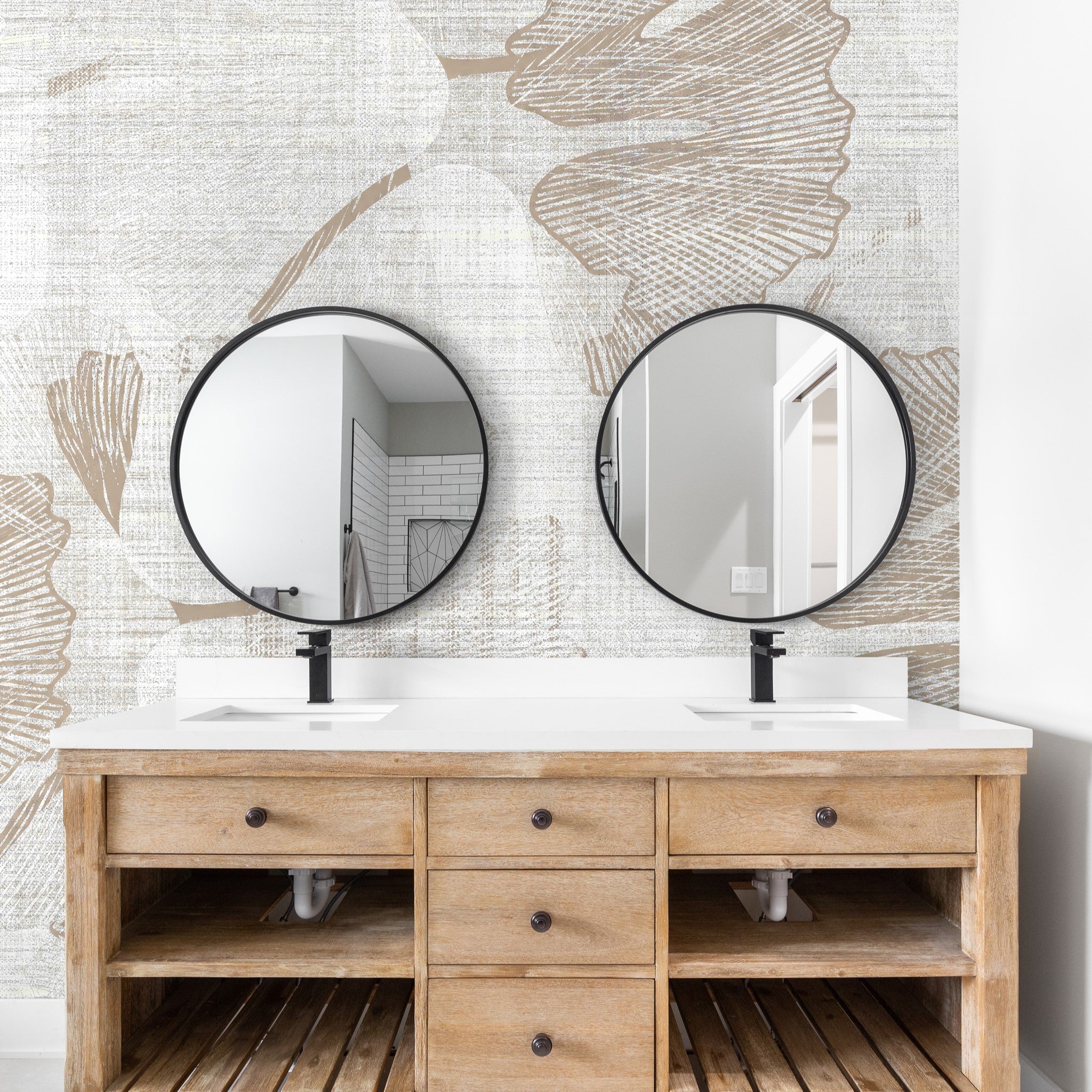 "Wall Blush Gayle Wallpaper installation in modern bathroom, featuring stylish vanity and round mirrors focused on wall decor."