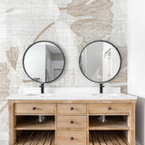 "Wall Blush Gayle Wallpaper installation in modern bathroom, featuring stylish vanity and round mirrors focused on wall decor."