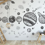 "Apollo Wallpaper by Wall Blush featured in stylish playroom with space-themed designs."