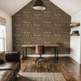 "Wall Blush's Trail Blazer (Brown) Wallpaper featured in a stylish home office setup with wooden furnishings."