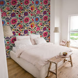 "Wall Blush's Azalea Wallpaper in a modern bedroom highlighting the vivid floral design as a focal point."