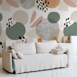 "Selina Wallpaper by Wall Blush, modern abstract design in a chic living room with sofa, stylish home decor focus."