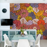 "Vibrant Juno Wallpaper by Wall Blush in modern dining room setting, showcasing colorful floral designs."