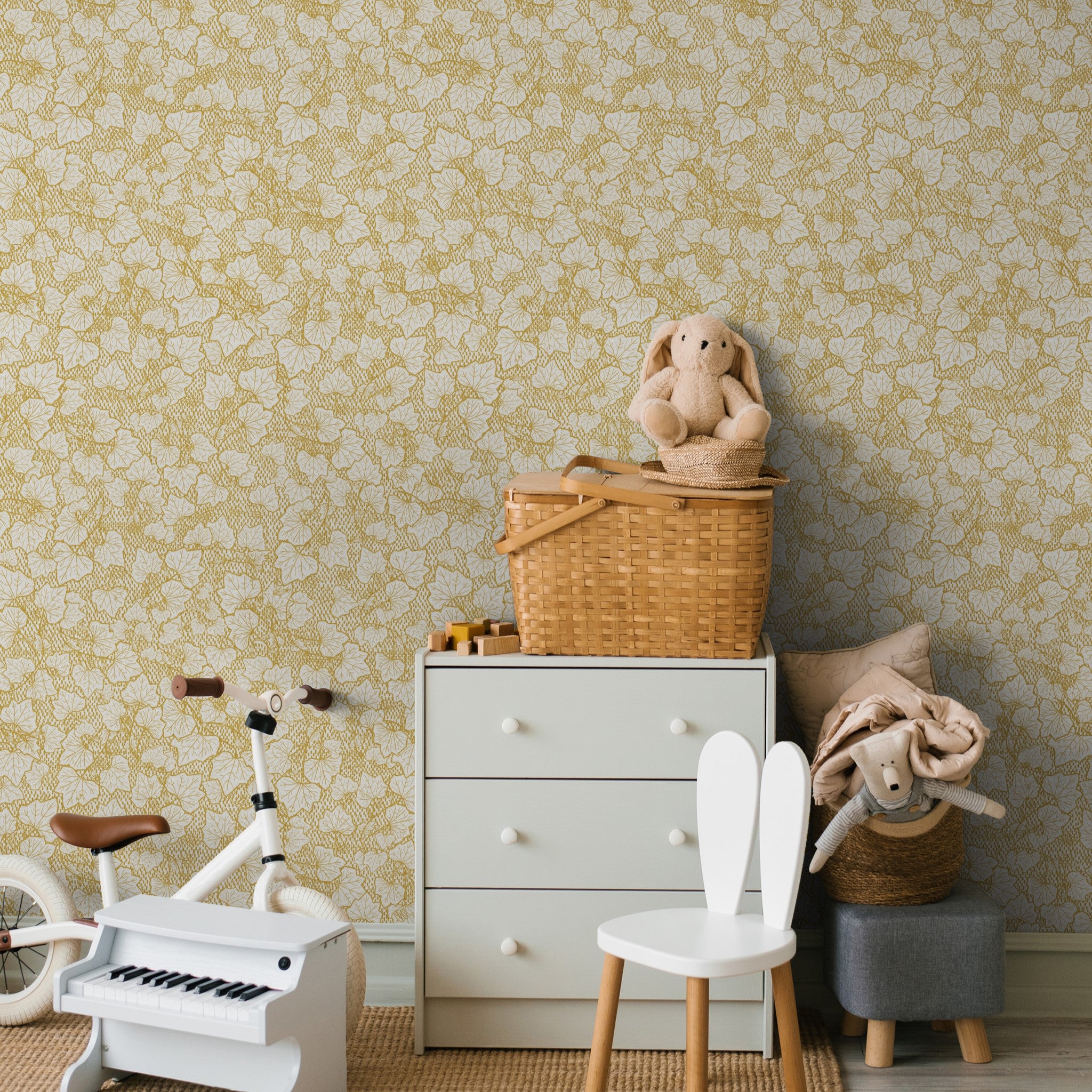 "Wall Blush 'Heath Wallpaper' in a cozy nursery room, with neutral-toned decor highlighting the pattern."