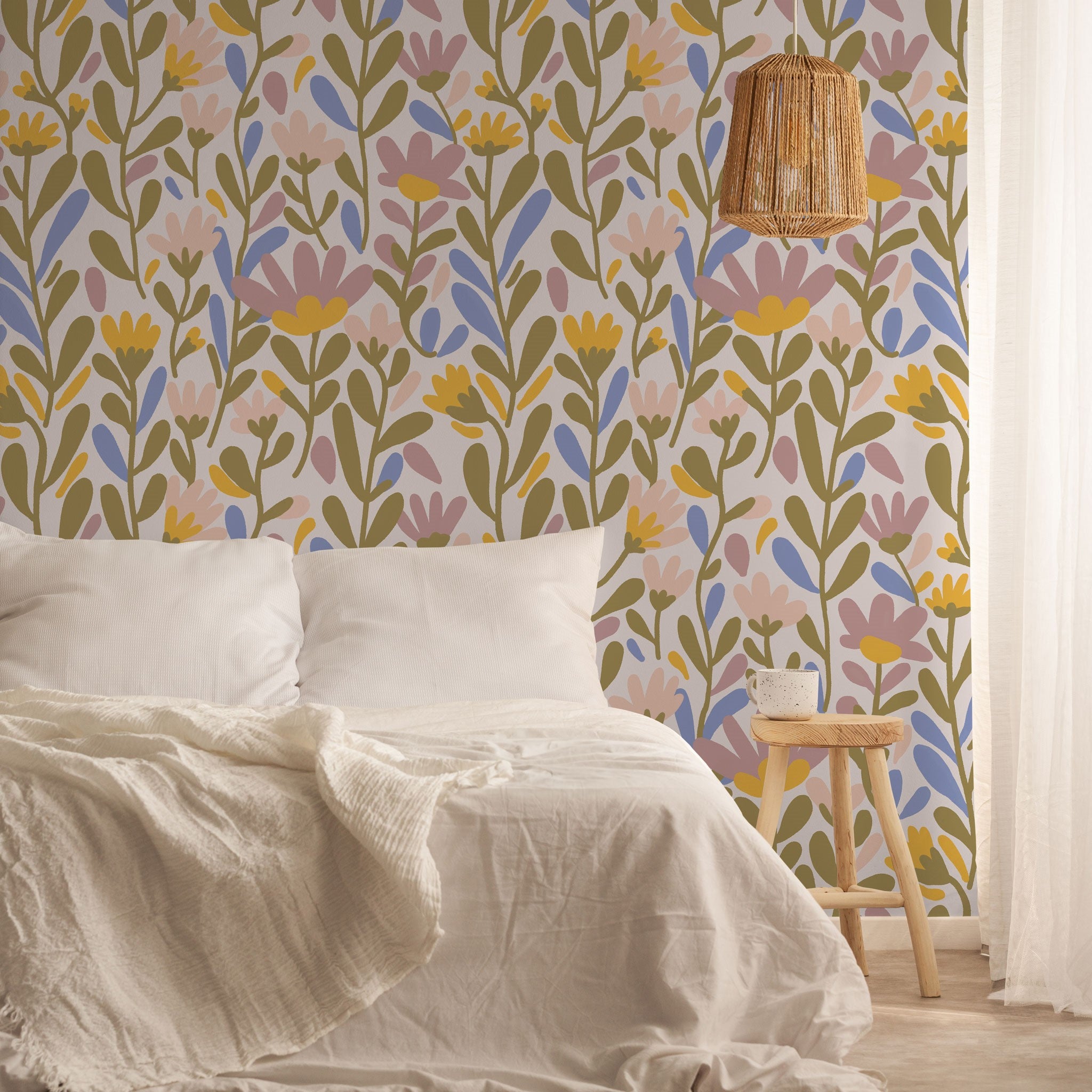 "Wall Blush's Summer Florals Wallpaper featured in cozy bedroom setting, highlighting vibrant pattern and design."
