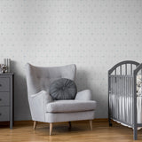 "Noble Wallpaper by Wall Blush in a cozy nursery, featuring stylish accent chair and crib."