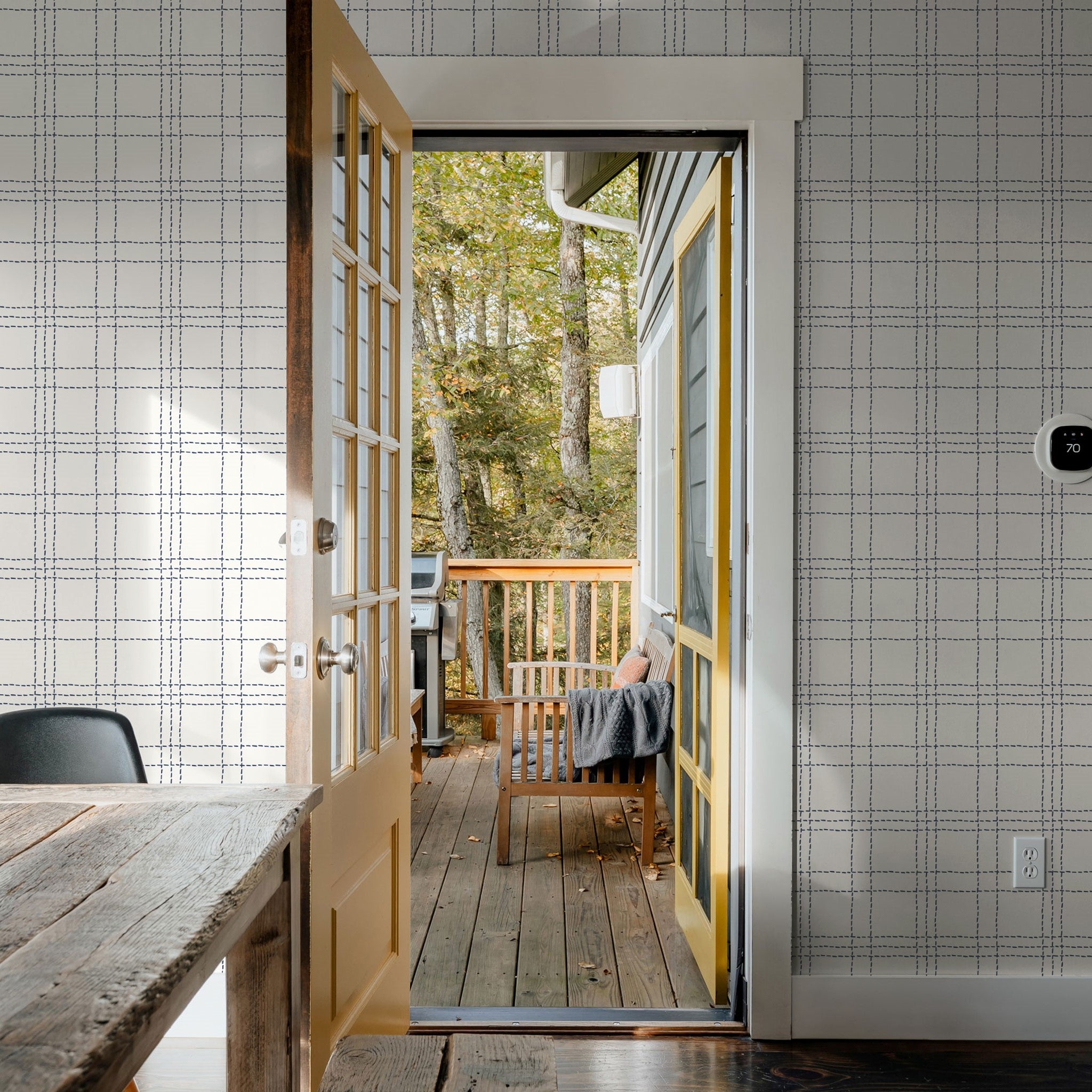 "Jovie Wallpaper by Wall Blush adding elegance to a home office, with open door to a serene deck."