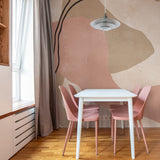 "Breve Wallpaper by Wall Blush enhancing a modern dining room, showcasing stylish wall decor focus."