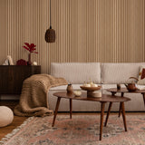 Wall Blush Timber Wallpaper enhancing a cozy living room decor, with stylish furnishings.