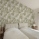 "The Kaycee Wallpaper from Wall Blush in a cozy bedroom setting highlighting the floral pattern."
