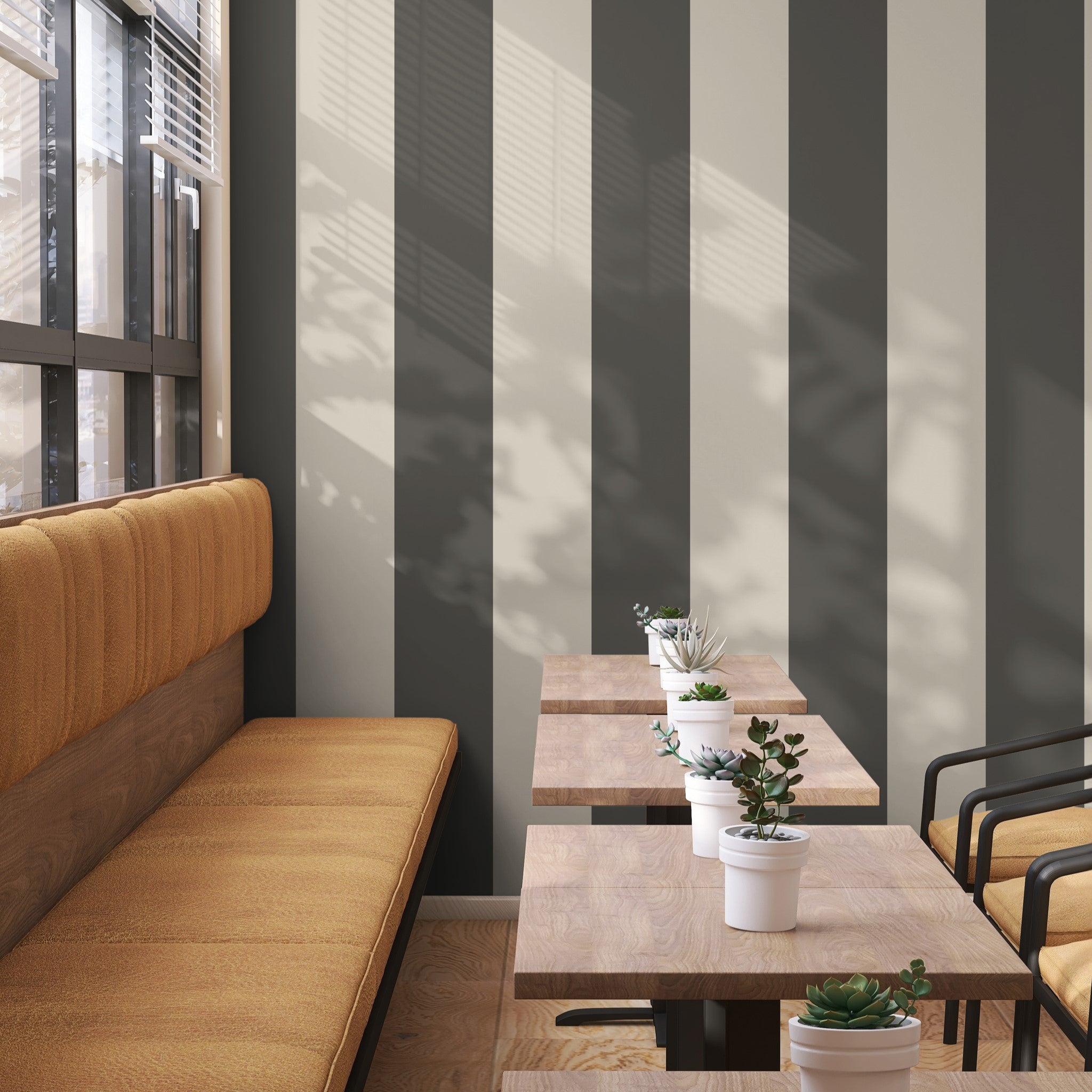 "Aldo Wallpaper by Wall Blush accentuating a modern cafe interior with striped design focus."