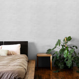 "Plaster Perfect Wallpaper by Wall Blush in serene bedroom setting, highlighting the textured wall focus."