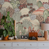"Sage and Tango Wallpaper by Wall Blush featured in stylish home office setup, emphasizing wall decor."