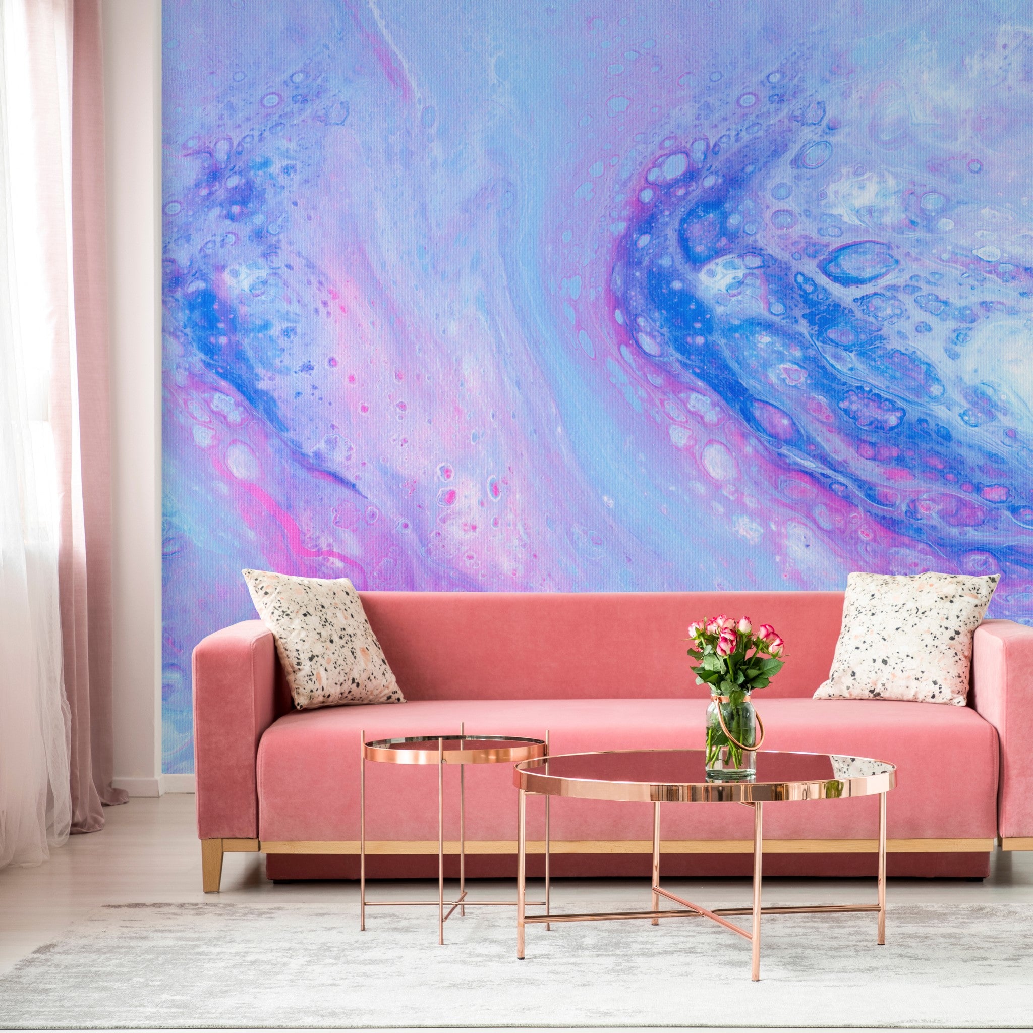 "Vibrant Malibu Wallpaper by Wall Blush enhancing the living room's modern decor with pink accents."