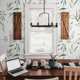 "Fiona Wallpaper by Wall Blush adorns a cozy dining room, highlighting the elegant botanical design."