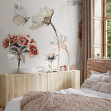 "Wall Blush's Wildflower Dreams Wallpaper in white adorning a cozy bedroom wall, highlighting the elegant floral design."