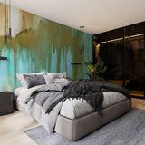 "Modern bedroom featuring Wall Blush's Venice Wallpaper with vibrant green and gold hues as the focal point."