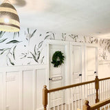 "Fiona Wallpaper by Wall Blush in hallway with botanical design enhancing home decor."
