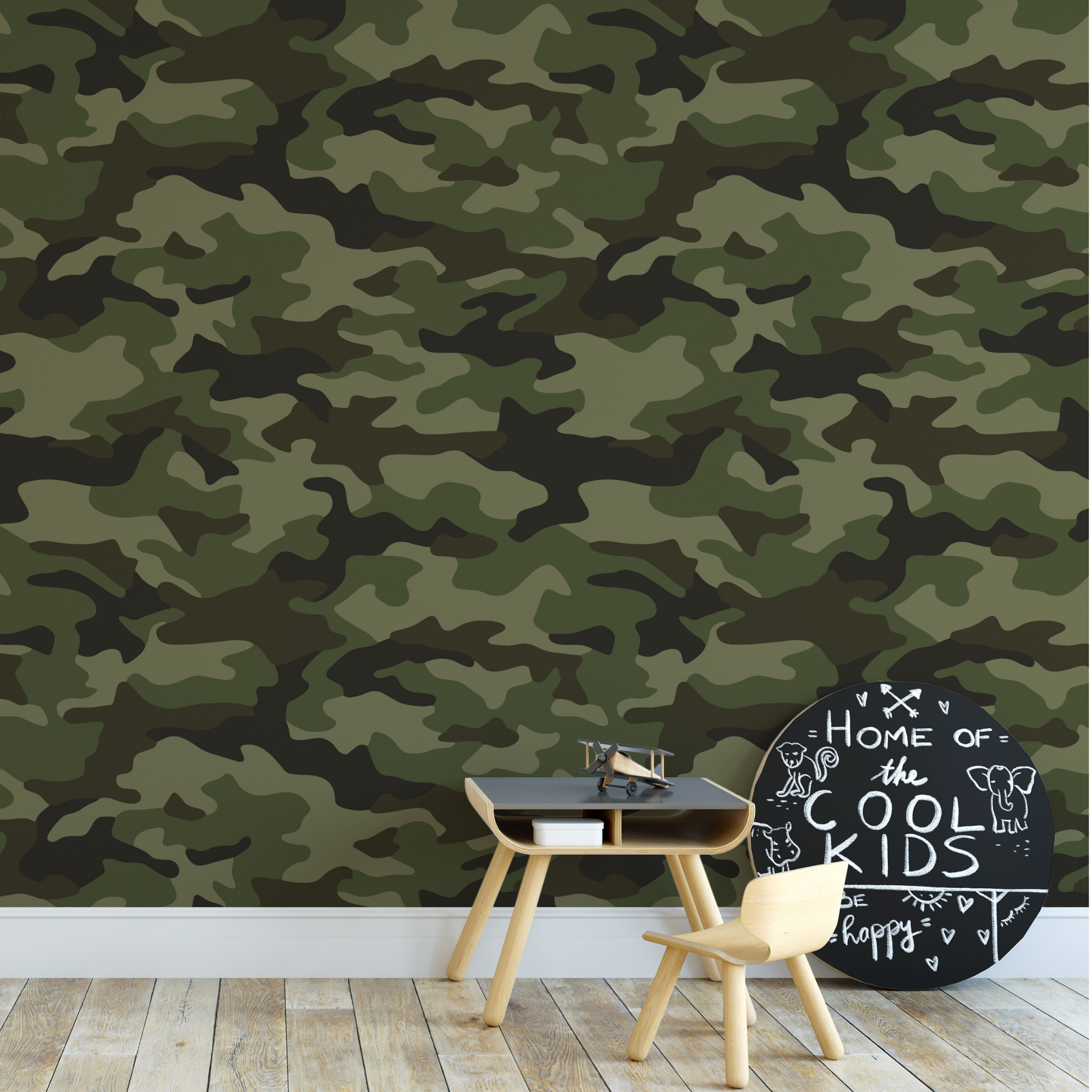 "Wall Blush's Abbott Wallpaper in a stylish children's room, featuring a modern camouflage design."