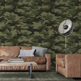 "Wall Blush's Abbott Wallpaper showcased in a stylish living room with focus on the unique camo pattern."