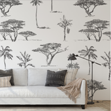 "Acacia Wallpaper by Wall Blush enhancing a modern living room, with a focus on elegant tree patterns."