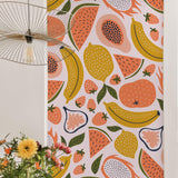 Ambrosia Wallpaper from Wall Blush SG02 featuring in a vibrant dining room, highlighted by colorful fruit patterns.
