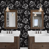 La Jolla design Wall Blush AW01 wallpaper in a modern bathroom with dual sinks and pendant lights.
