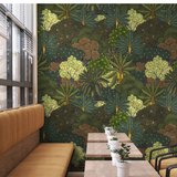 "Wall Blush Baloo Wallpaper in modern dining room with tropical design and wooden furniture."